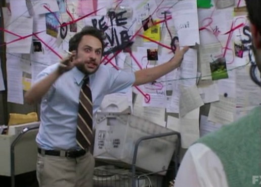 the original meme screencap of crazy charlie with wild eyes and a wall covered in paper and strings