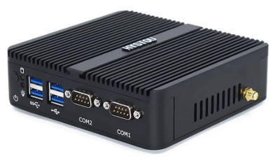 picture of the mini pc - it's a small black rectangle with heatsink ribbing on the top and ports on the side