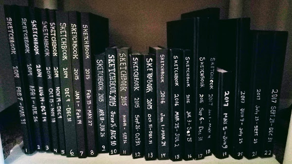 my shelf of sketchbooks