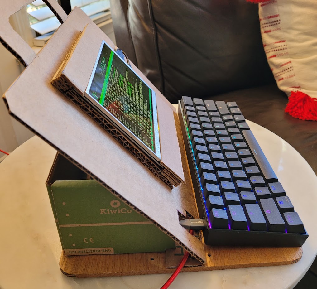 a side view of my raspberry pi zero-powered cardboard laptop luggable computer showing how it is constructed