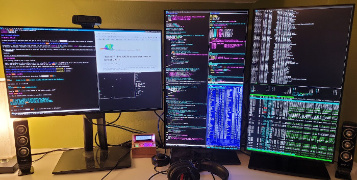 one landscape and two portrait monitors