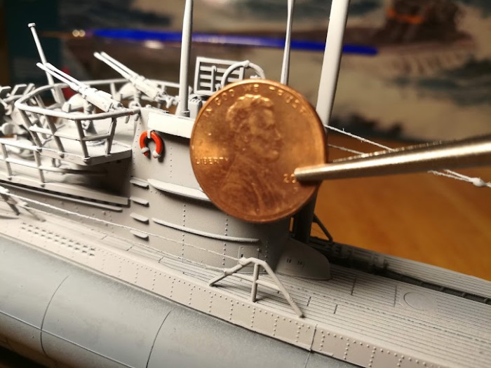 picture of the u-boat tower next to a u.s. penny coin