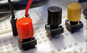 cute little momentary button switches on my breadboard