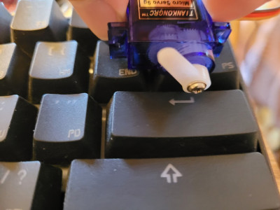 photo of servo pressing the enter key