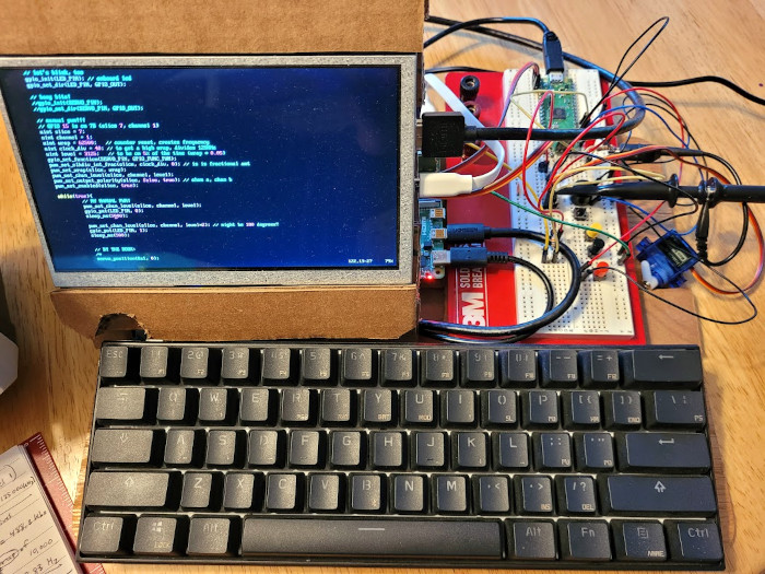 my pi computer and pico breadboard setup with the servo and scope hooked up